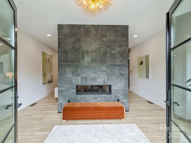 112 Manning Dr, Charlotte, NC 28209 - living area with light wood-type flooring, a large fireplace, baseboards, and recessed lighting