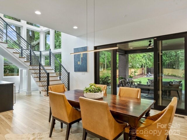 112 Manning Dr, Charlotte, NC 28209 - dining space featuring light wood-type flooring, stairway, healthy amount of natural light, recessed lighting, and ceiling fan