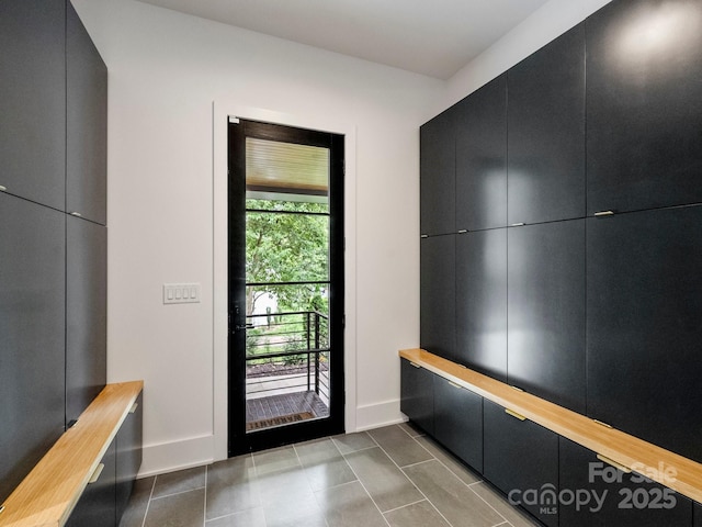 112 Manning Dr, Charlotte, NC 28209 - mudroom with baseboards and dark tile patterned floors