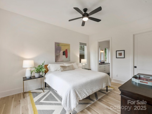 112 Manning Dr, Charlotte, NC 28209 - bedroom featuring light wood-style floors, baseboards, connected bathroom, and ceiling fan