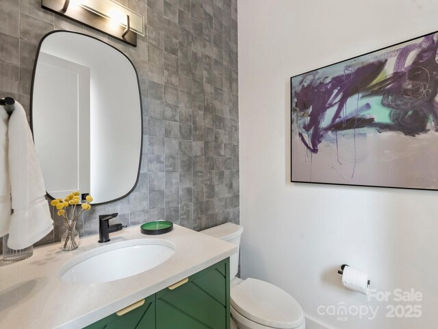 112 Manning Dr, Charlotte, NC 28209 - bathroom featuring tile walls, vanity, and toilet