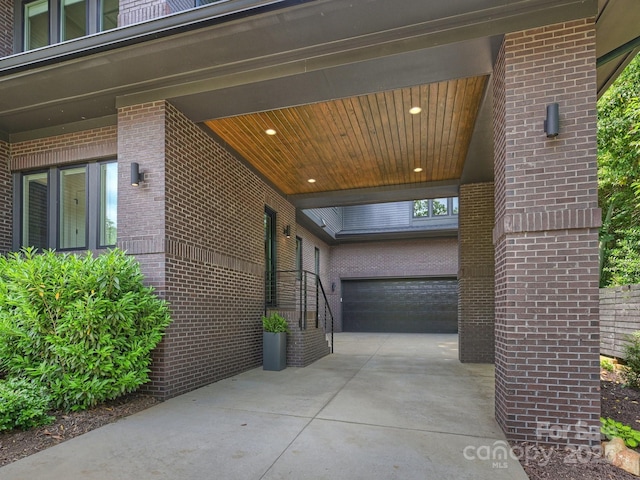 112 Manning Dr, Charlotte, NC 28209 - view of home's exterior with concrete driveway, an attached garage, and brick siding