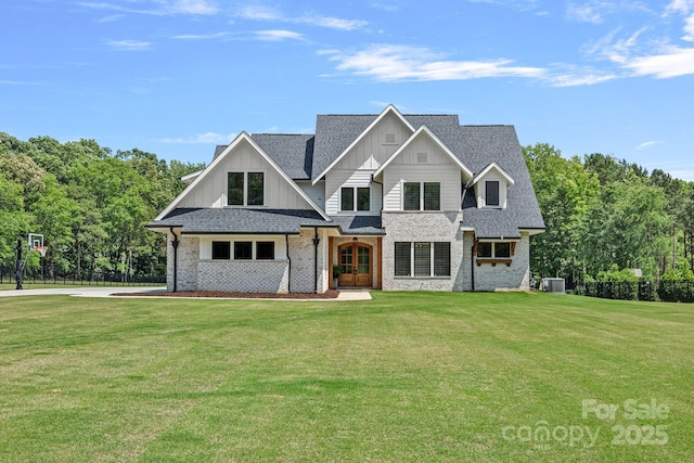 1405 Waxhaw Marvin Rd, Waxhaw, NC 28173 - view of front of property with board and batten siding, central air condition unit, brick siding, and a shingled roof