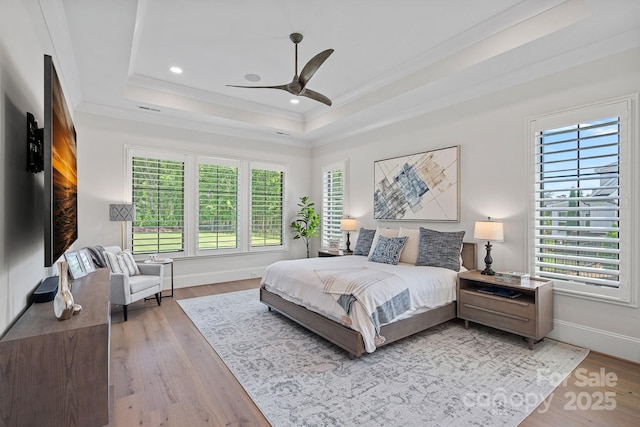 1405 Waxhaw Marvin Rd, Waxhaw, NC 28173 - bedroom with a tray ceiling, ornamental molding, multiple windows, light wood-type flooring, and recessed lighting