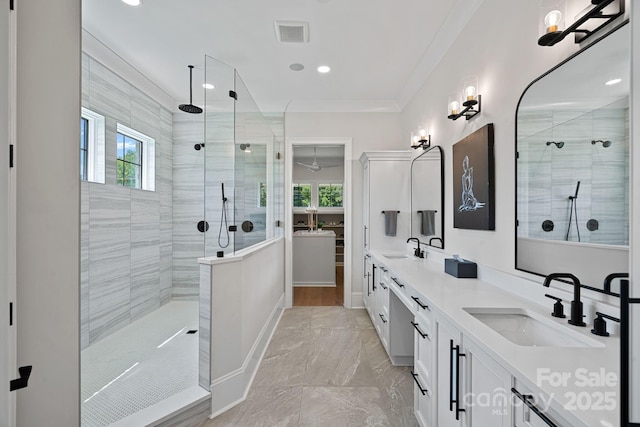 1405 Waxhaw Marvin Rd, Waxhaw, NC 28173 - bathroom with a tile shower, double vanity, plenty of natural light, marble finish floors, and recessed lighting