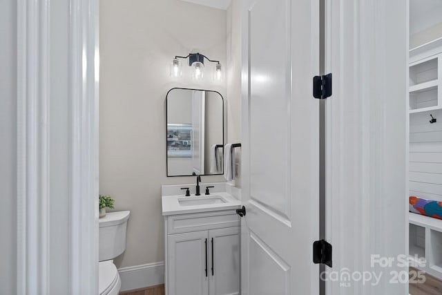 1405 Waxhaw Marvin Rd, Waxhaw, NC 28173 - bathroom with toilet, vanity, wood finished floors, and baseboards