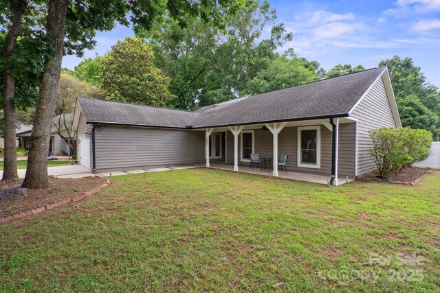 3807 Sweetgrass Ln, Charlotte, NC 28226 - ranch-style house featuring an attached garage, a front lawn, a shingled roof, and driveway