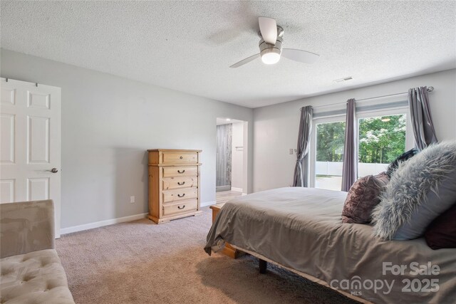 3807 Sweetgrass Ln, Charlotte, NC 28226 - bedroom featuring access to exterior, a textured ceiling, carpet, a ceiling fan, and baseboards
