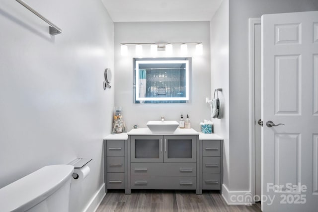 3807 Sweetgrass Ln, Charlotte, NC 28226 - full bath with vanity, toilet, wood finished floors, baseboards, and a shower