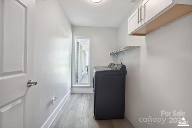 3807 Sweetgrass Ln, Charlotte, NC 28226 - washroom with separate washer and dryer, wood finished floors, cabinet space, and baseboards