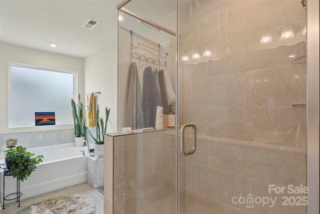 13327 Savaine St, Charlotte, NC 28278 - bathroom featuring a bath, a stall shower, and tile patterned floors