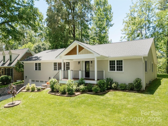330 Balsam Rd, Hendersonville, NC 28792 - view of front of home with a garage, a porch, a front lawn, and brick siding