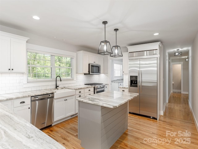 330 Balsam Rd, Hendersonville, NC 28792 - kitchen featuring appliances with stainless steel finishes, a sink, recessed lighting, tasteful backsplash, and white cabinets