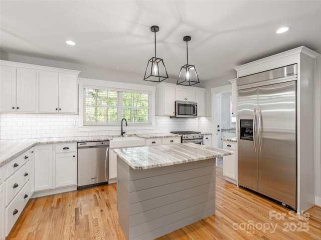 330 Balsam Rd, Hendersonville, NC 28792 - kitchen with appliances with stainless steel finishes, a sink, white cabinetry, recessed lighting, and backsplash