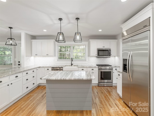 330 Balsam Rd, Hendersonville, NC 28792 - kitchen featuring stainless steel appliances, a sink, white cabinets, decorative backsplash, and recessed lighting