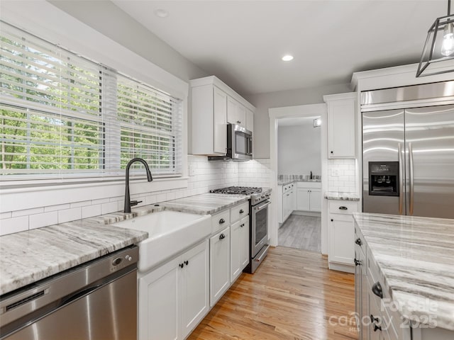 330 Balsam Rd, Hendersonville, NC 28792 - kitchen featuring appliances with stainless steel finishes, a sink, white cabinetry, backsplash, and recessed lighting