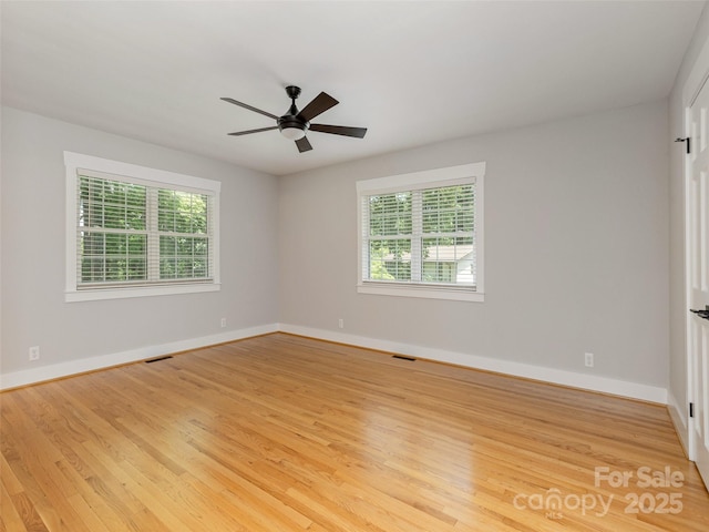 330 Balsam Rd, Hendersonville, NC 28792 - spare room featuring light wood finished floors, baseboards, and ceiling fan