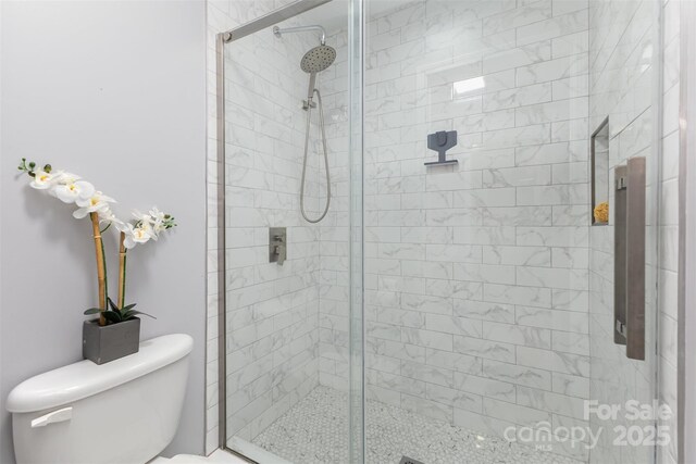 121 Quality Dr, Mount Holly, NC 28120 - full bathroom with a shower stall and toilet