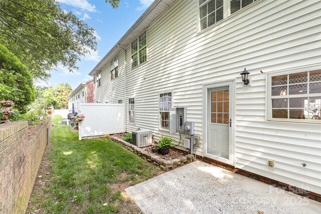 121 Quality Dr, Mount Holly, NC 28120 - rear view of property with central AC unit
