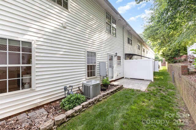 121 Quality Dr, Mount Holly, NC 28120 - rear view of house with central AC