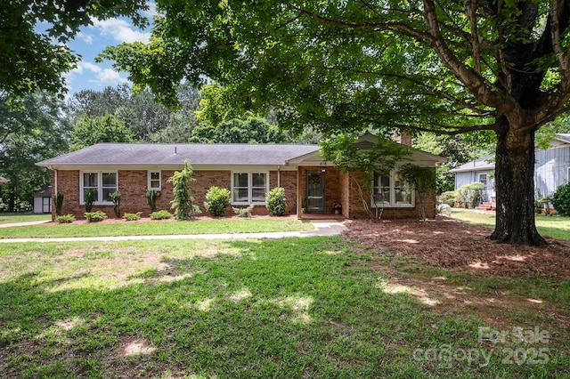 418 Melody Ln, Shelby, NC 28152 - ranch-style house featuring brick siding, a front lawn, and roof with shingles