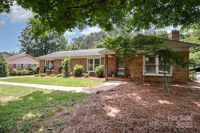 418 Melody Ln, Shelby, NC 28152 - ranch-style house with brick siding, a front lawn, and a chimney