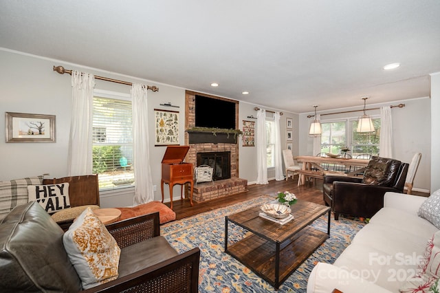 418 Melody Ln, Shelby, NC 28152 - living area featuring ornamental molding, wood finished floors, a fireplace, healthy amount of natural light, and baseboards