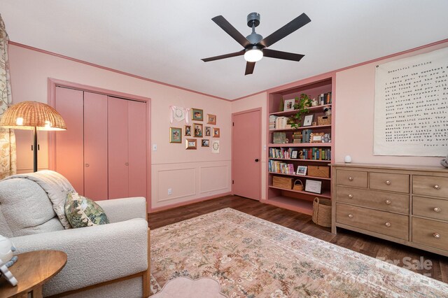 418 Melody Ln, Shelby, NC 28152 - sitting room with wood finished floors, a ceiling fan, ornamental molding, and built in features