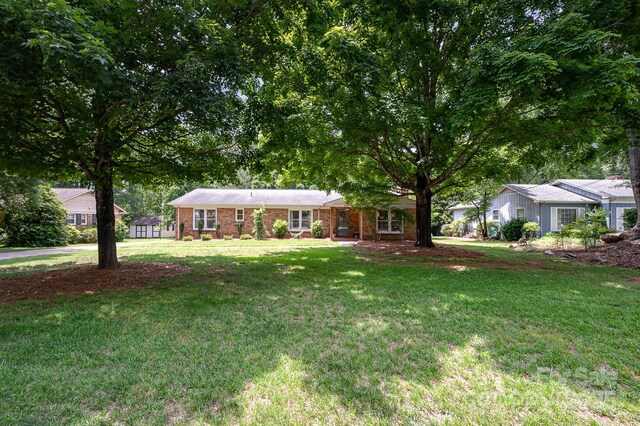 418 Melody Ln, Shelby, NC 28152 - single story home with a front yard and brick siding