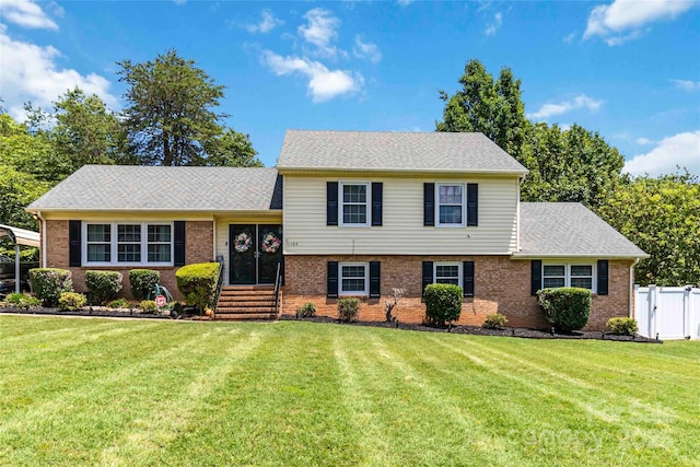 1104 Colony Ct, Gastonia, NC 28056 - split level home featuring brick siding, entry steps, and roof with shingles