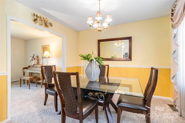 1104 Colony Ct, Gastonia, NC 28056 - dining room featuring a chandelier, carpet floors, and baseboards
