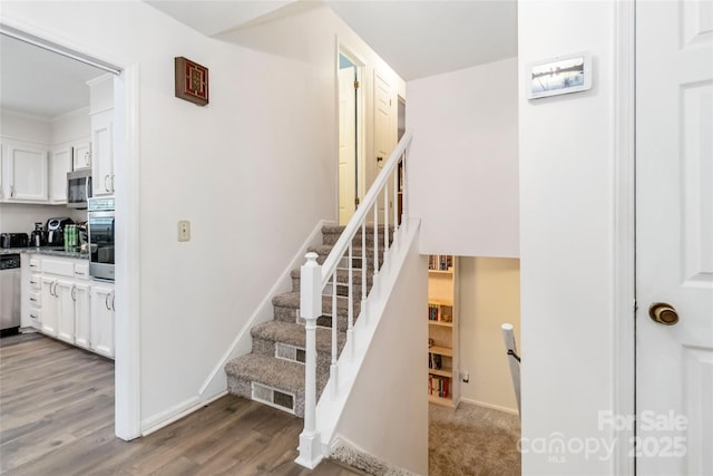 1104 Colony Ct, Gastonia, NC 28056 - staircase featuring wood finished floors and baseboards