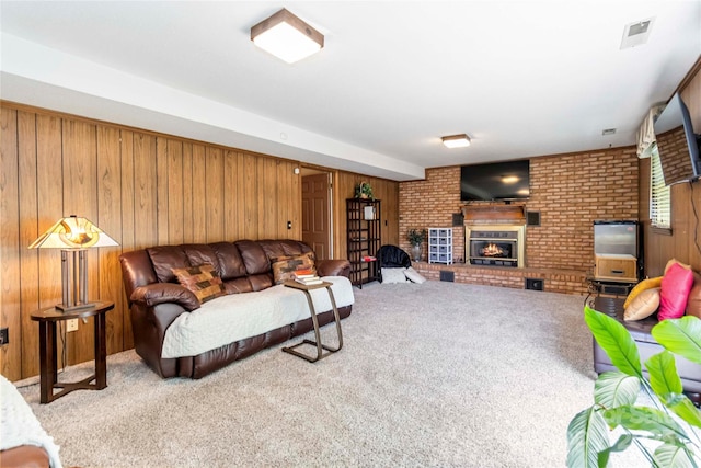 1104 Colony Ct, Gastonia, NC 28056 - carpeted living area with wood walls, a brick fireplace, and brick wall