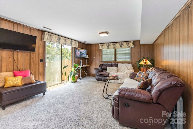 1104 Colony Ct, Gastonia, NC 28056 - living room featuring wood walls and carpet floors