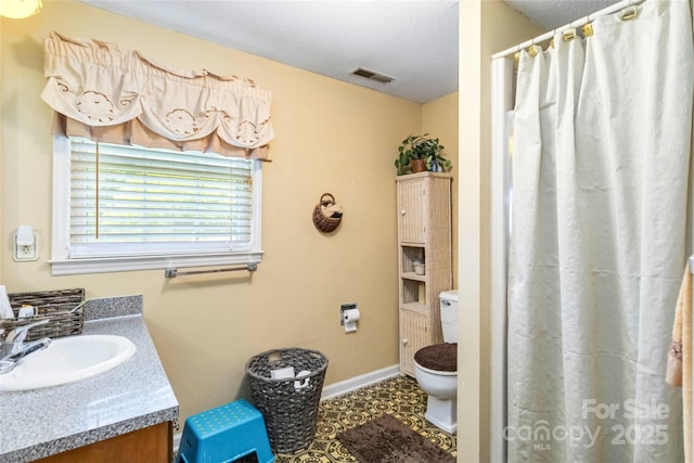 1104 Colony Ct, Gastonia, NC 28056 - bathroom featuring toilet, vanity, baseboards, and a shower with curtain