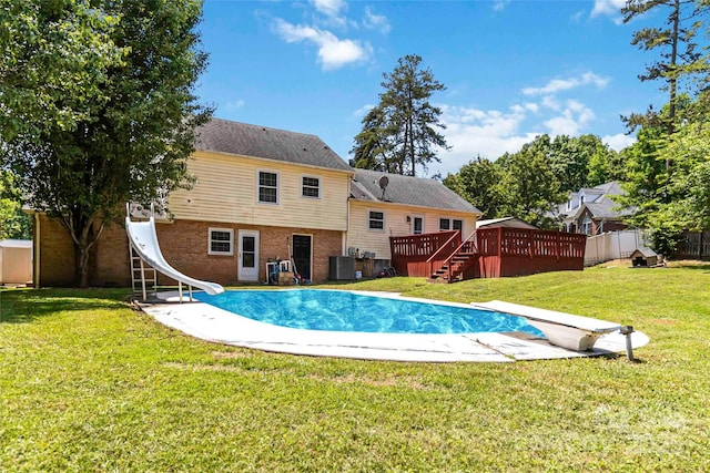 1104 Colony Ct, Gastonia, NC 28056 - view of swimming pool with a diving board, a water slide, central AC unit, and a wooden deck