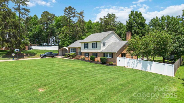 1104 Colony Ct, Gastonia, NC 28056 - split level home with a chimney and brick siding