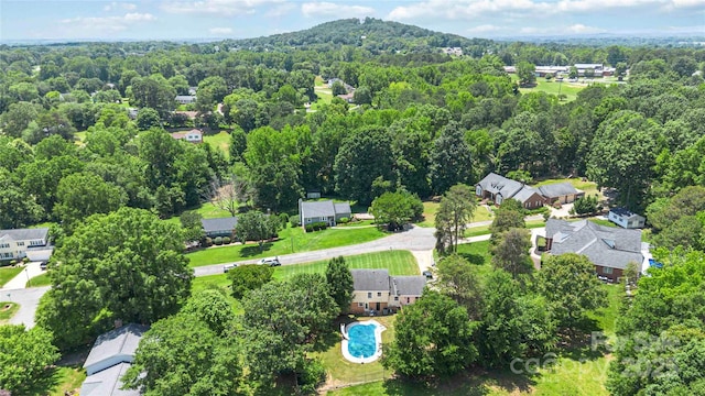 1104 Colony Ct, Gastonia, NC 28056 - aerial perspective of suburban area with a forest and a pool area