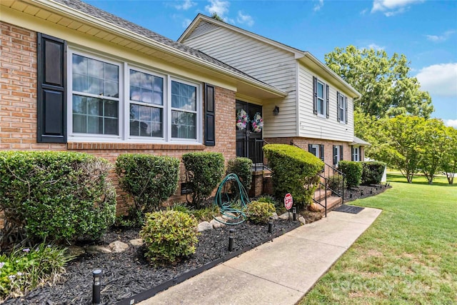 1104 Colony Ct, Gastonia, NC 28056 - view of front of house with brick siding and a front yard
