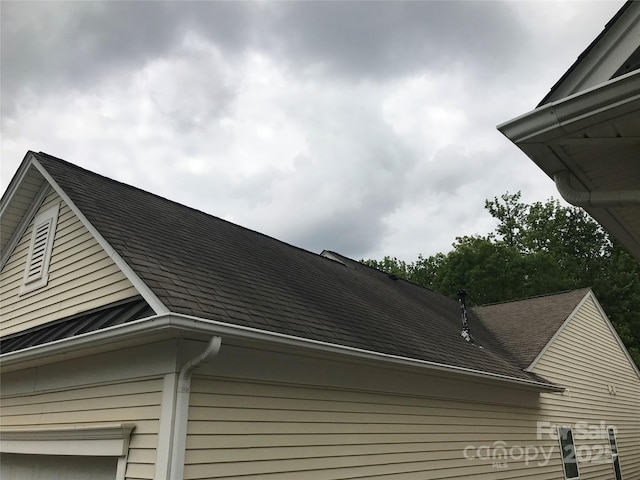 19157 Mallard Dr, Fort Mill, SC 29707 - exterior view of roof with shingles, gutters, and a downspout