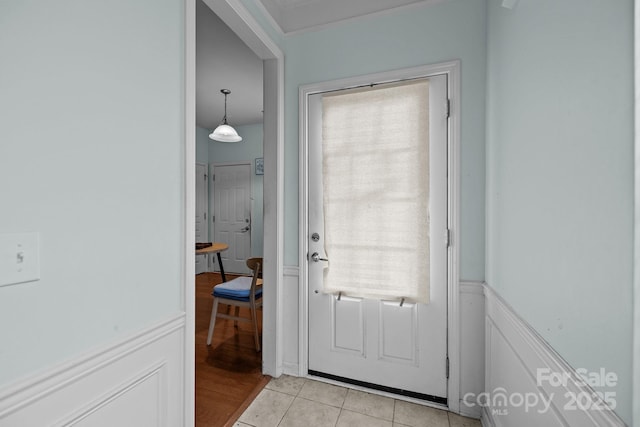 19157 Mallard Dr, Fort Mill, SC 29707 - entryway with a wainscoted wall, light tile patterned floors, and ornamental molding