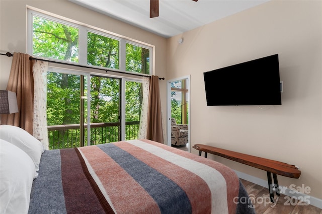 145 Old Still Rd, Maggie Valley, NC 28751 - bedroom featuring access to exterior, baseboards, a ceiling fan, and wood finished floors