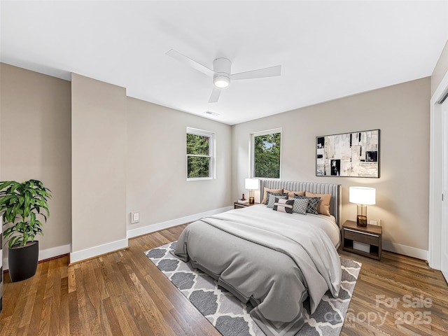 162 Courtland Pl, Asheville, NC 28801 - bedroom featuring baseboards, wood finished floors, and ceiling fan