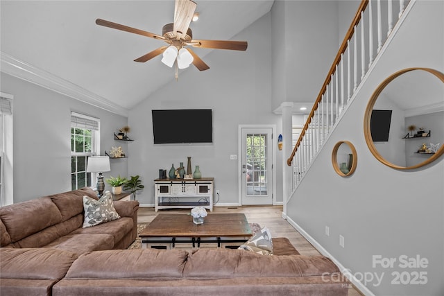 7830 Sarah Dr, Denver, NC 28037 - living room with stairway, a ceiling fan, high vaulted ceiling, wood finished floors, and baseboards