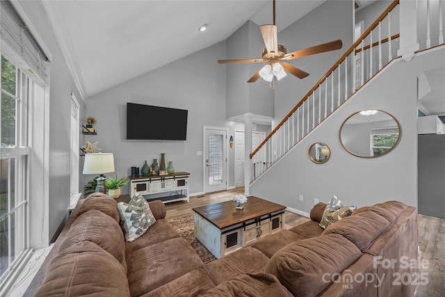 7830 Sarah Dr, Denver, NC 28037 - living room with ornate columns, high vaulted ceiling, a ceiling fan, wood finished floors, and baseboards