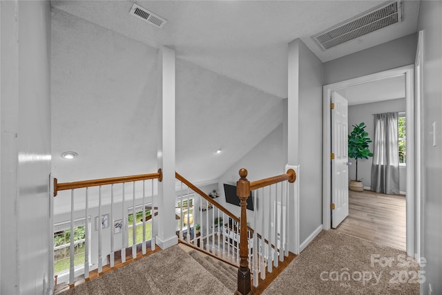 7830 Sarah Dr, Denver, NC 28037 - corridor featuring an upstairs landing, wood finished floors, vaulted ceiling, and baseboards
