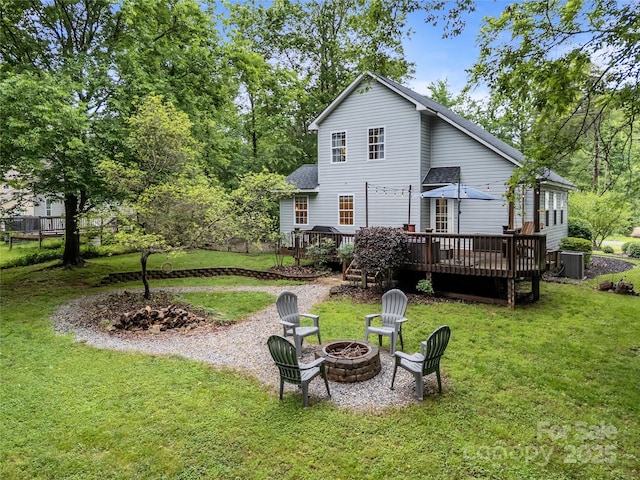 7830 Sarah Dr, Denver, NC 28037 - rear view of property with a fire pit, a wooden deck, a yard, and a shingled roof