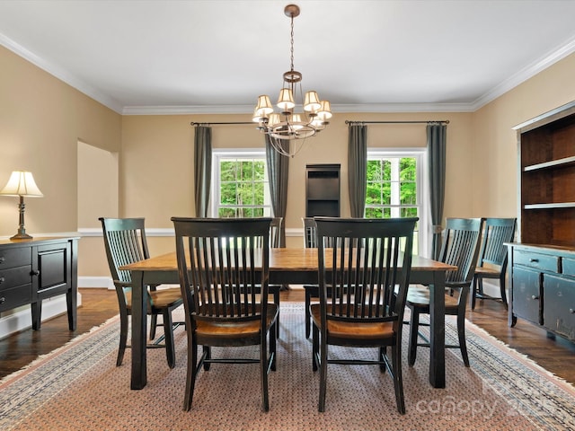 1010 Arabian Farm Rd, Clover, SC 29710 - dining room featuring healthy amount of natural light, a chandelier, wood finished floors, ornamental molding, and baseboards