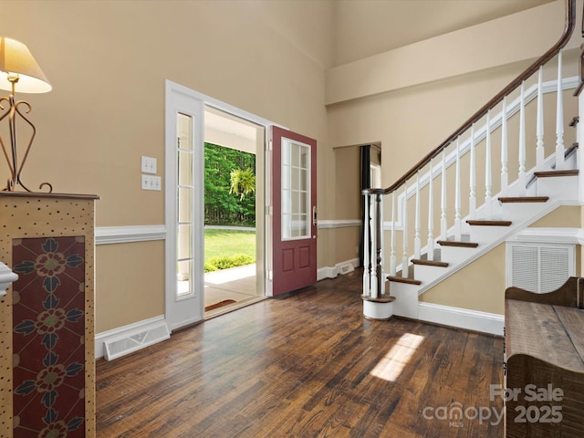 1010 Arabian Farm Rd, Clover, SC 29710 - entrance foyer featuring wood finished floors, stairs, a towering ceiling, and baseboards