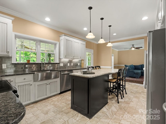 1010 Arabian Farm Rd, Clover, SC 29710 - kitchen with stainless steel appliances, a sink, open floor plan, decorative backsplash, and a ceiling fan